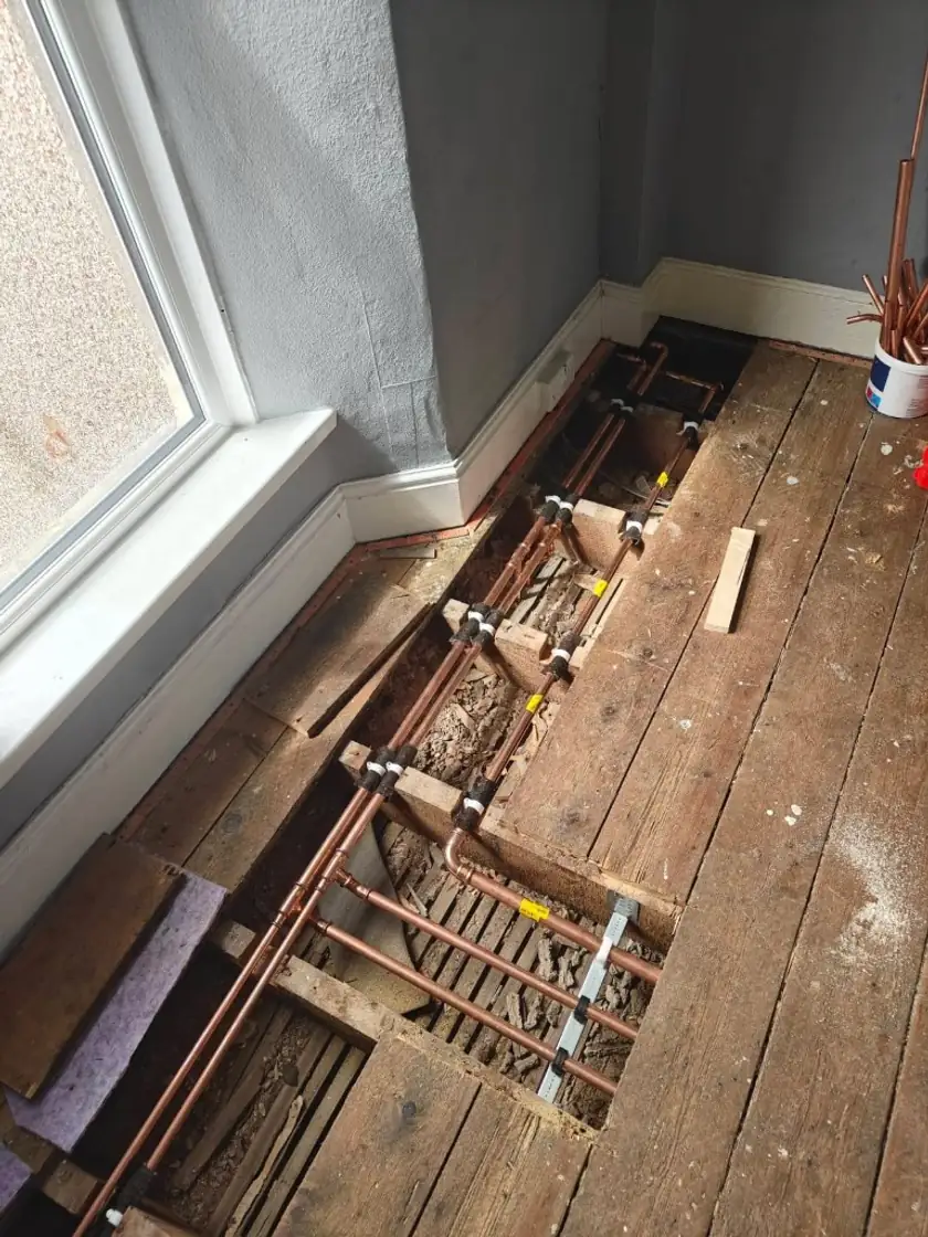 Copper heating first-fix pipework on a renovation