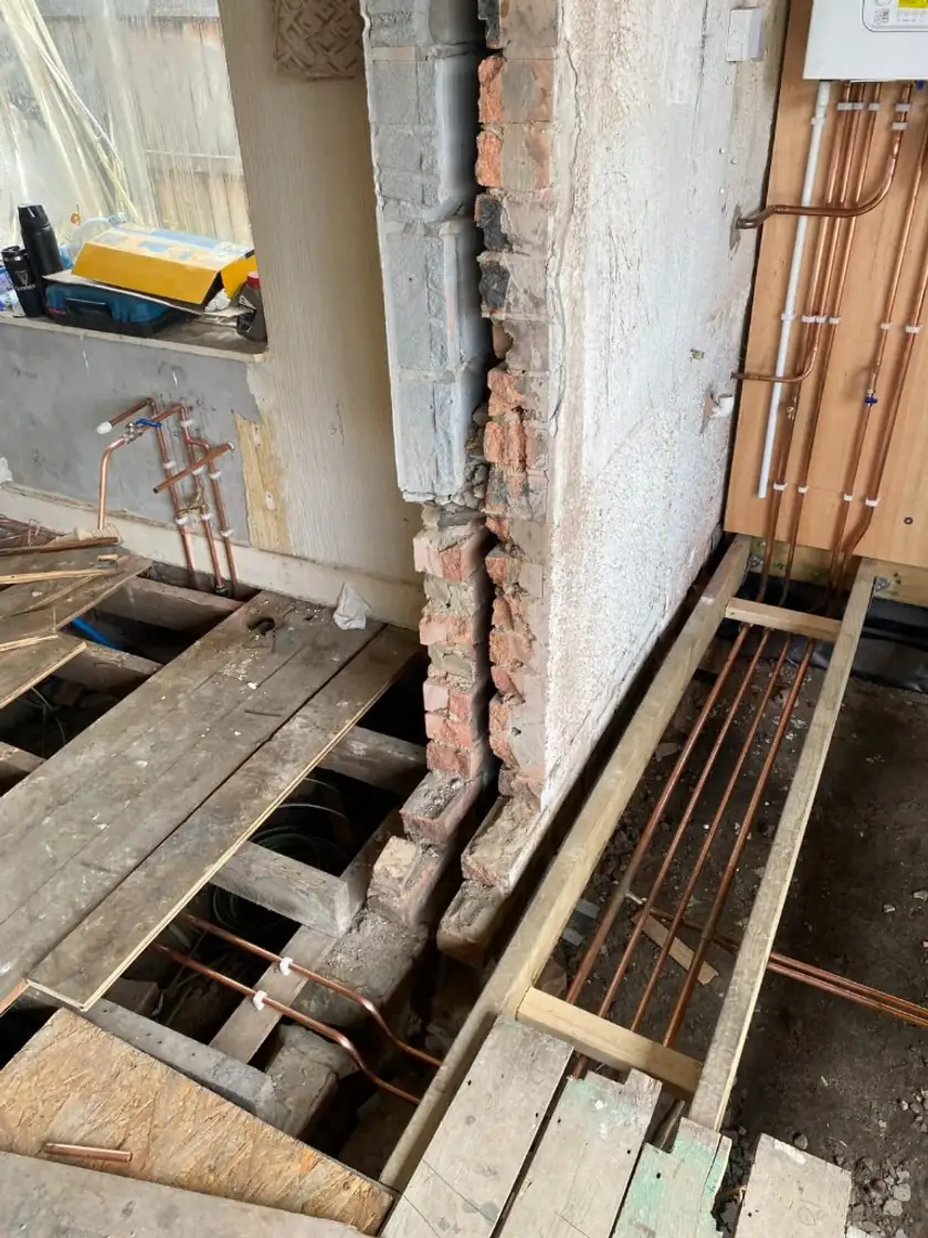 Copper plumbing pipework installed under floorboards